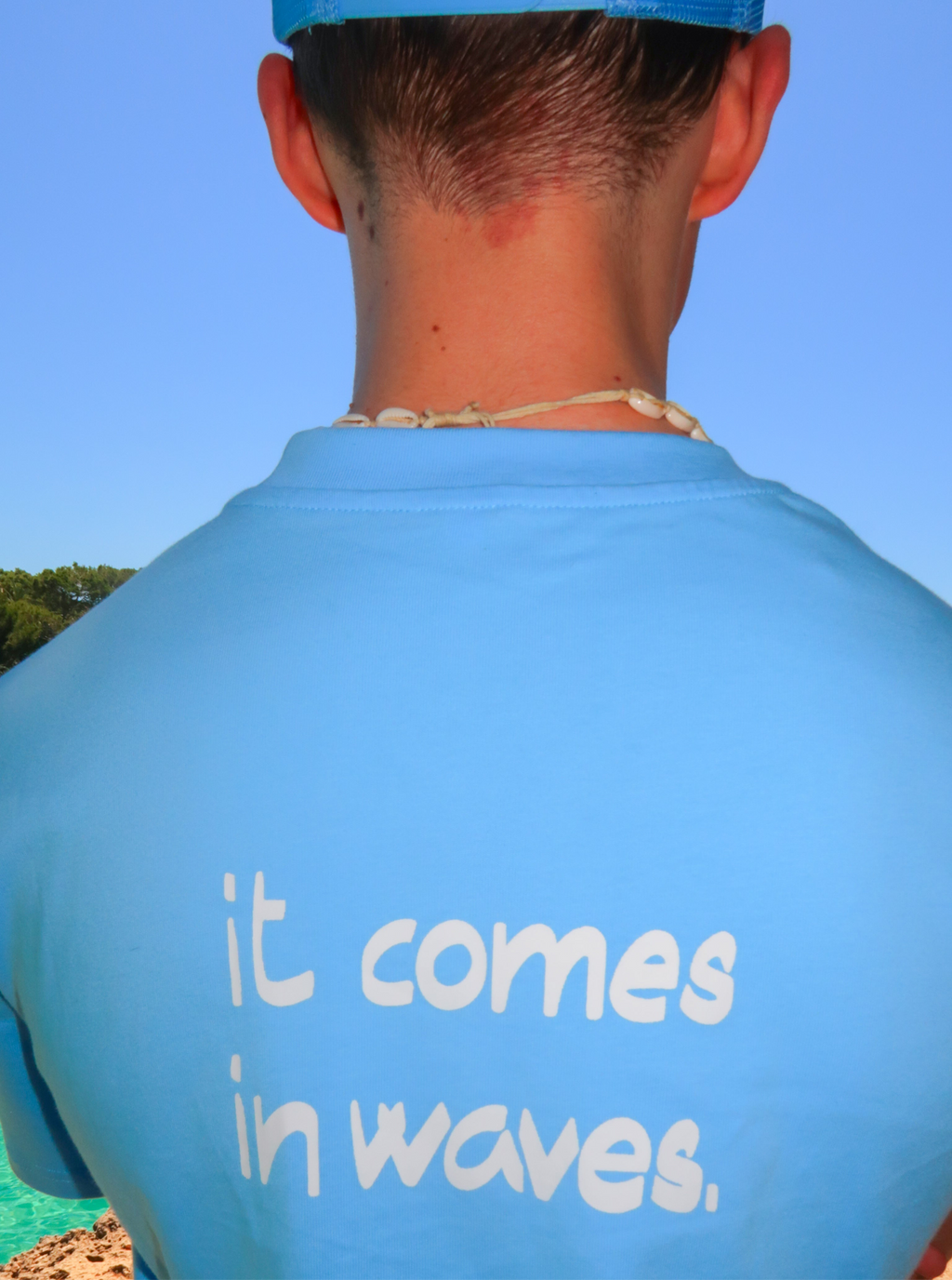 Blue tee "it comes in waves"